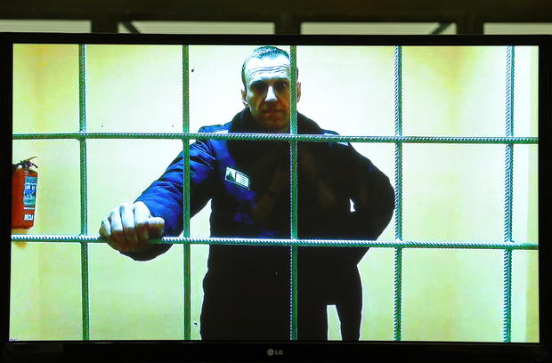 Jailed Russian opposition leader Alexei Navalny attends a court hearing via video link 