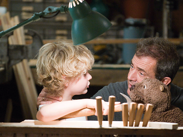 Riley Thomas Stewart, left, and Mel Gibson are shown in a scene from, "The Beaver." 