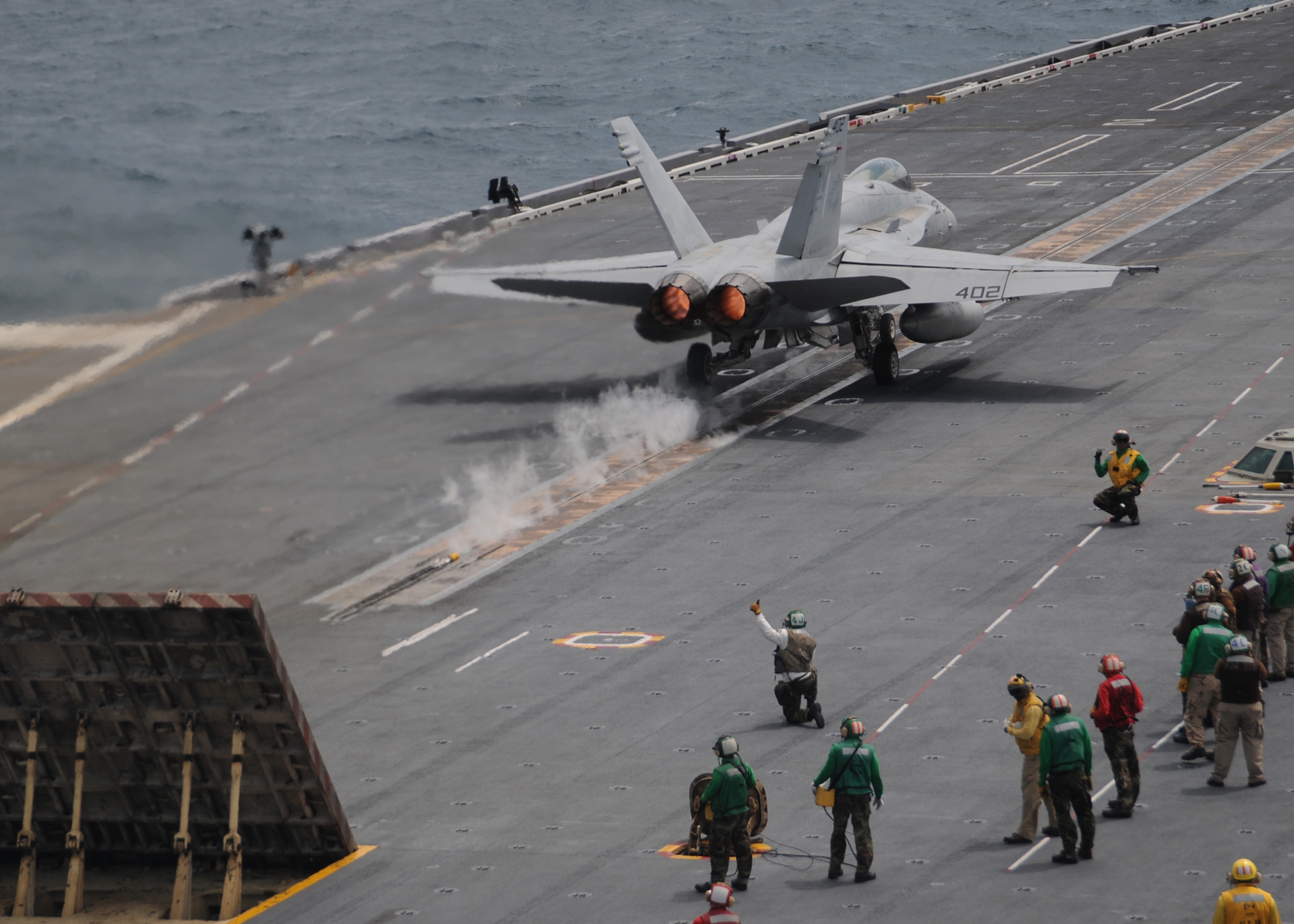 An F/A-18C Hornet from the Dambusters, Strike Fire Squadron (VFA-195) launches off the flight deck aboard USS George Washington (CVN 73) .  