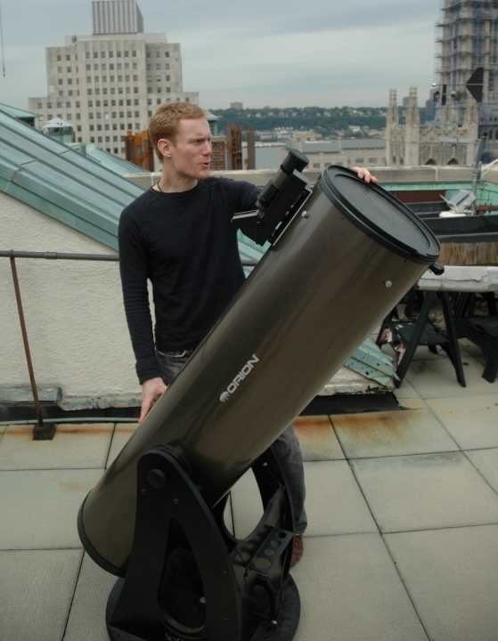 Astronomer Cameron Hummels and telescope 