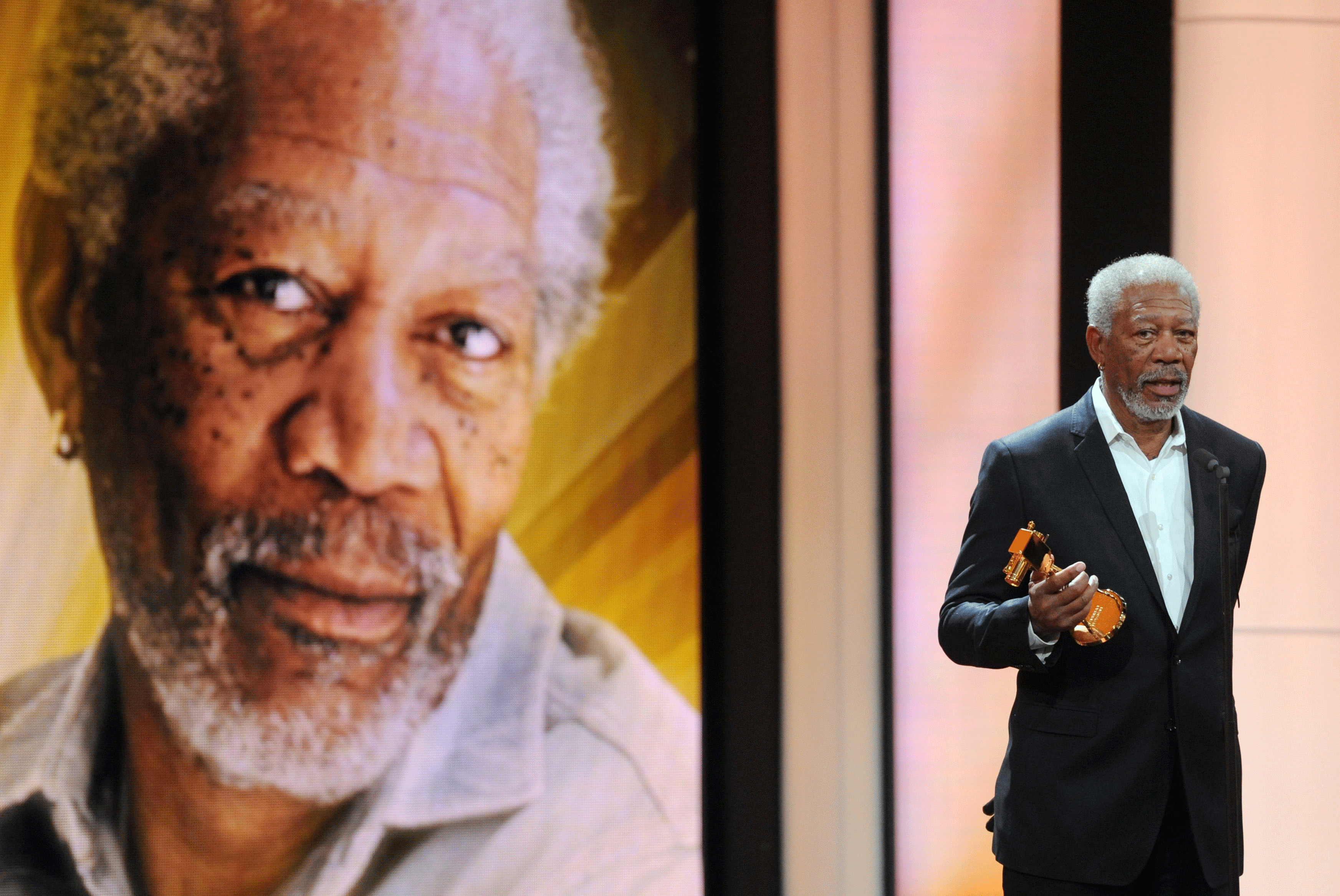 Actor Morgan Freeman holds his trophy in the category "International Lifetime Achievement" during the 47th Golden Camera award ceremony in Berlin, on Feb. 4, 2012.  
