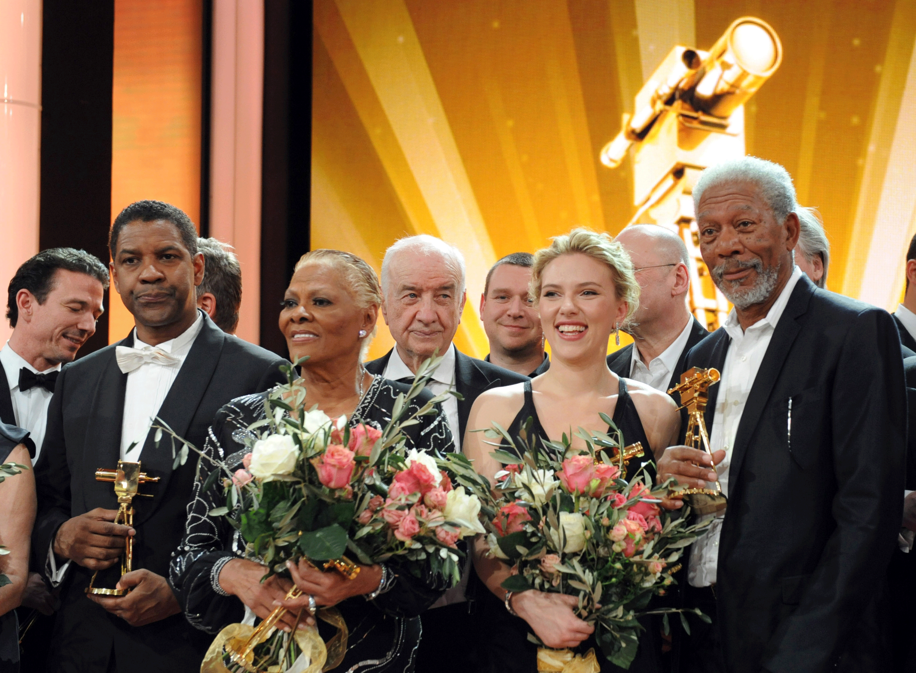 From left, actor Denzel Washington, singer Dionne Warwick, German actor Armin Mueller-Stahl, actress Scarlett Johansson and  actor Morgan Freeman  pose on stage for a group photo after the 47th Golden Camera award ceremony in Berlin  Feb. 4, 2012.  