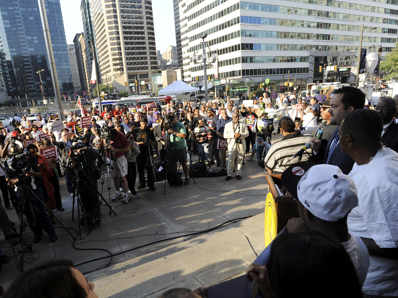 President of the NAACP, Benjamin Todd Jealous, right, speaks to a crowd during the NAACP voter ID rally to demonstrate the opposition of Pennsylvania's new voter identification law, Sept. 13, 2012.  