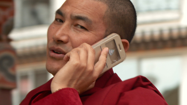 bhutan-bhutanese-man-on-cell-phone-620.jpg 