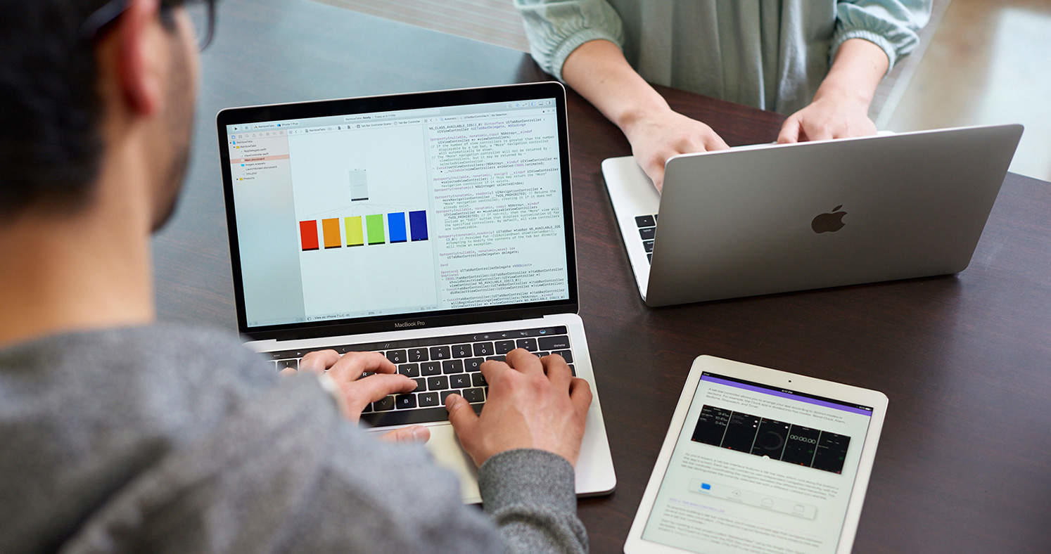 Students using MacBooks 