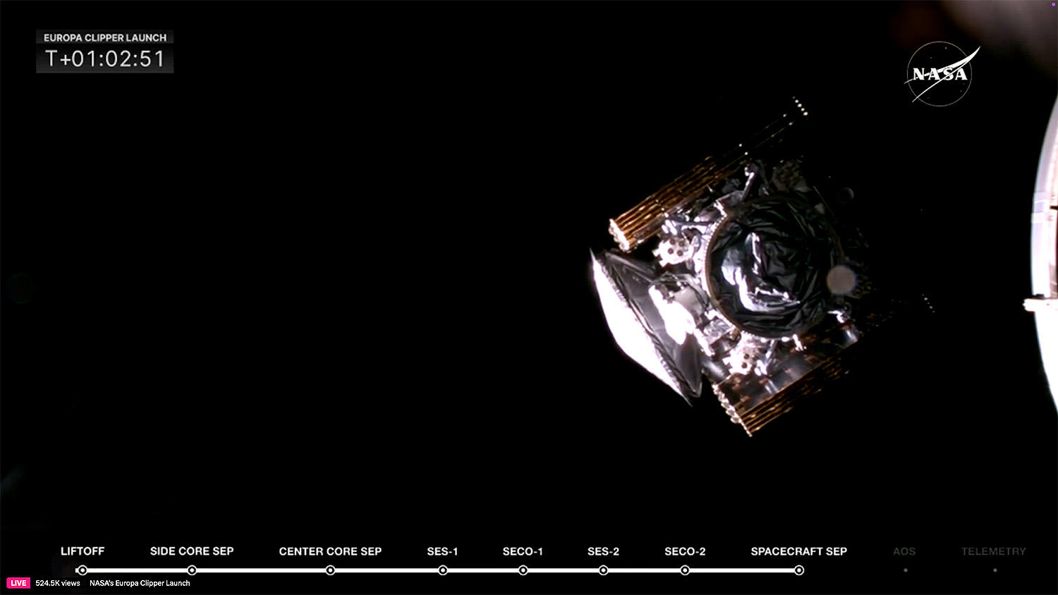 A camera on the Falcon Heavy's second stage captures a view of the Europa Clipper, its solar arrays still folded, moments after it was released to fly on its own. 