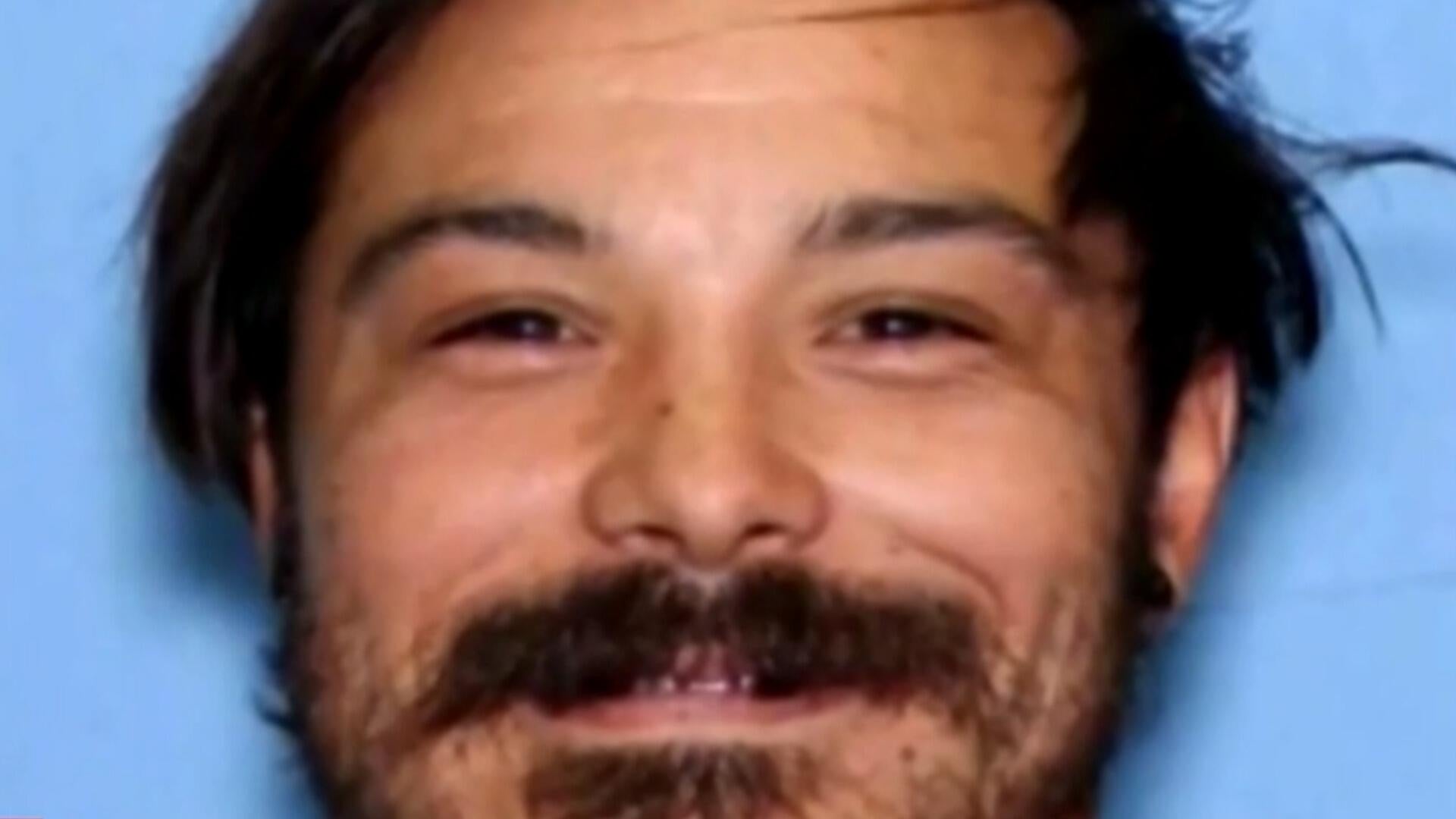 Residents urged to lock doors amid search for dad accused of murder