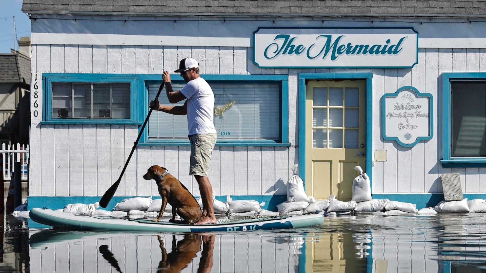 Photos show record-breaking tides flooding homes, roads in California