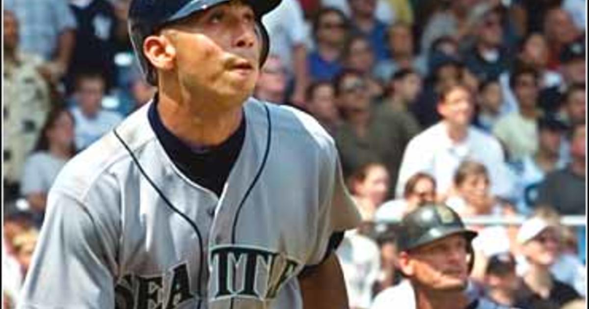 Manager Lou Piniella of the Seattle Mariners walks back towards