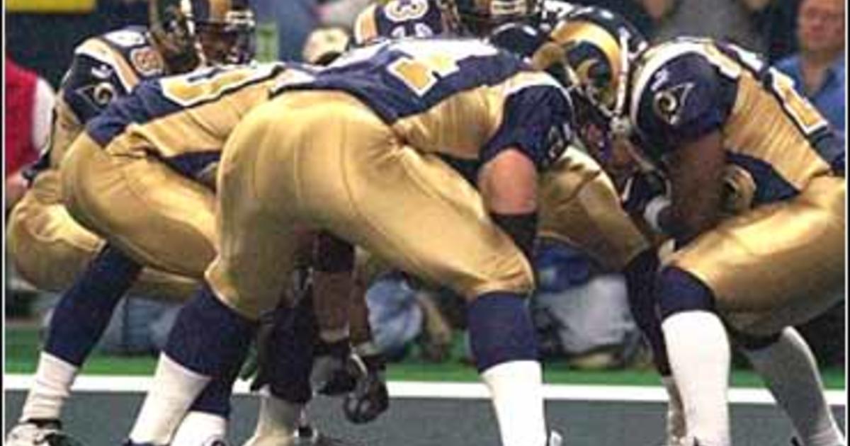 Former St. Louis Rams Isaac Bruce holds the Super Bowl trophy during  ceremonies celebrating the teams Super Bowl victory in the 1999-2000  season, at the Edward Jones Dome during half time of