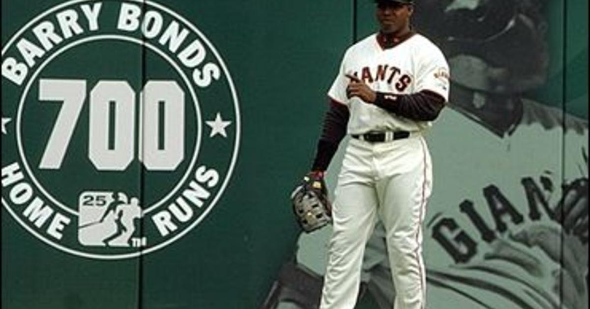 San Francisco Giants' Barry Bonds watches his three-run homer off