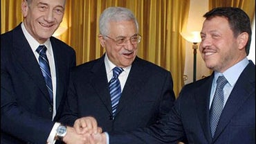 Israeli Prime Minister Ehud Olmert, left, shakes hands with Palestinian President Mahmoud Abbas, also known as Abu Mazen, center, and Jordan's King Abdullah 