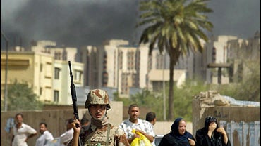 An Iraqi soldier secures an area 
