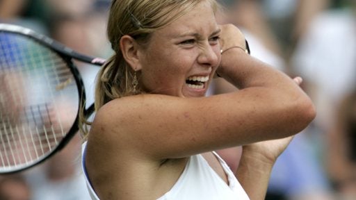 Maria Sharapova of Russia returns a shot 