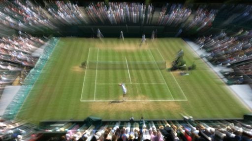 Dmitry Tursunov of Russia plays Croatia's Ivan Ljubicic during their Men's Singles 