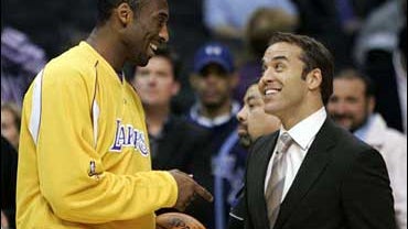 Los Angeles Lakers' Kobe Bryant tapes a scene with actor Jeremy Piven for the HBO series "Entourage" at the Staples Center before the Lakers basketball game against the Golden State Warriors Tuesday, April 11, 2006, in Los Angeles. 