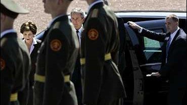 President Bush, center, and his wife Laura Bush arrive to attend a ceremony at the Monument to the Heroic Defenders of Leningrad in St. Petersburg, Russia, Friday, July 14, 2006. 