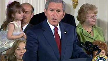 U.S. President George W. Bush vetoing stem-cell research 