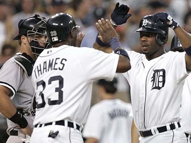 Detroit Tigers designated hitter Craig Monroe, right, is congratulated by Marcus Thames after hitting a grand slam 
