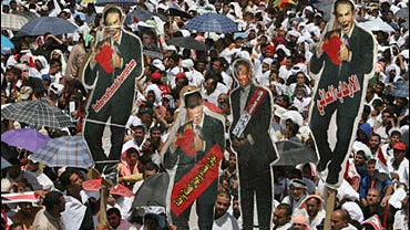 Carrying effigies of U.S. President George W. Bush, British Prime Minister Tony Blair and Israeli Prime Minister Ehud Olmert, Iraqi Shiites in the thousands gather in a mass demonstration against Israel's bombing of Lebanon 