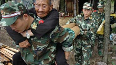 Old man evacuated in China before typhoon arrives 