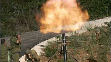Israeli soldiers fire mortar shells 