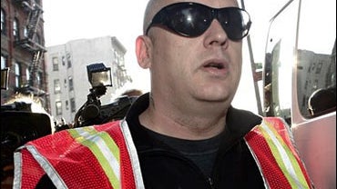 Boy George, who was born George O'Dowd, reports for garbage duty, Monday, Aug. 14, 2006, in New York. 