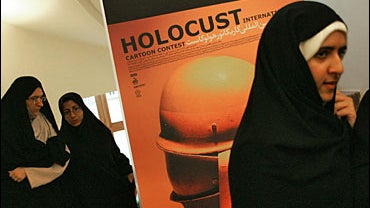 Iranian women attend the international cartoon contest on the Holocaust in Tehran, 14 August 2006. 