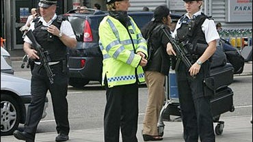 Armed police on duty outside Terminal 3 at London's Heathrow airport 