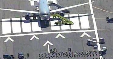 Passenger Disturbance Diverts Plane - CBS News