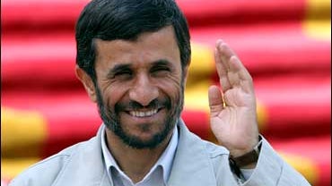 Iranian President Mahmoud Ahmadinejad, waves as he arrives at his office in Tehran, Iran on Tuesday Sept. 5, 2006. Iran's hard-line president Mahmoud Ahmadinejad on Tuesday called for an anti-liberal campaign in universities, another step back to 1980's-s 