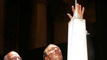 Architect David Childs (L) and New York Governor George Pataki view a model of the new revised design for the Freedom Tower which will be built on the World Trade Center site June 28, 2005 in New York City. The Freedom Tower will stand at 1,776 feet inclu 