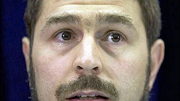 With tears in his eyes, Maher Arar reacts during a news conference on Monday Sept. 18, 2006 in Ottawa, Canada. 