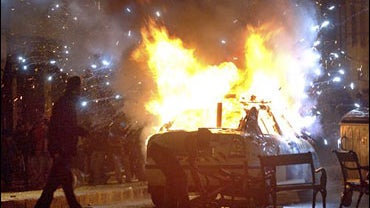 A police car blows up after Hungarian demonstrators set it on fire after occupying one of the main roads during an escalating anti-government protest in Budapest 