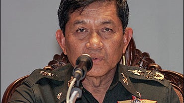 Thailand's coup leader, General Sonthi Boonyaratglin answers questions during a press conference at the Army headquarters in Bangkok 