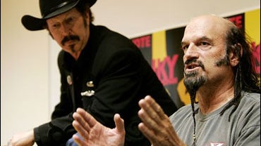 Former Minnesota Gov. Jesse Ventura, right, campaigns with Texas gubernatorial candidate Kinky Friedman on the campus of the University of Texas at San Antonio in San Antonio, Sept. 25, 2006. 