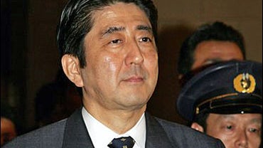 Japan's newly-elected Prime Minister Shinzo Abe walks out from the chamber of the House of Representatives at Parliament in Tokyo 