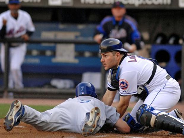 New York Mets catcher Paul Lo Duca, right, tags out Los Angeles Dodgers J.D. Drew at home plate in the second inning 