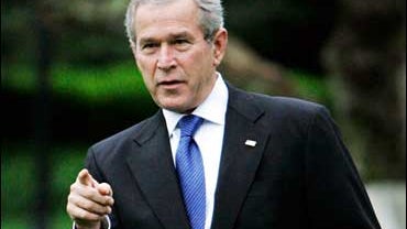 President Bush leaves the White House, to participate in the christening ceremony of the aircraft carrier George H.W. Bush, Saturday, Oct. 7, 2006, in Washington. 