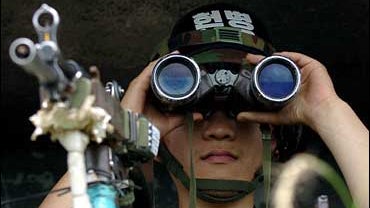  South Korean soldier keeps vigil at an observation point, on the southern side of the demilitarized zone (DMZ). 