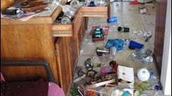 The contents of kitchen cabinets and a refrigerator are spilled across a floor in a Kailua-Kona, Hawaii kitchen after the earthquake that shook Hawaii Sunday Oct. 15, 2006. 