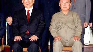 Tang with Kim Jong Il 