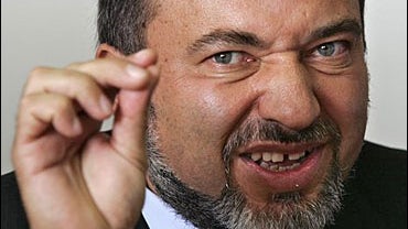 Avigdor Lieberman, leader of the right wing Yisrael Beiteinu party gestures during a party meeting at the Kenesset 