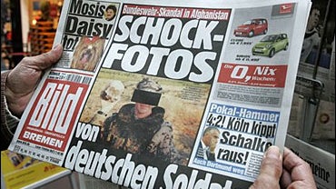A man holds a German newspaper "Bild" in Bremen, northern Germany, Wednesday, Oct. 25, 2006. 