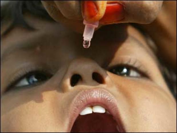 kid gets polio drop 