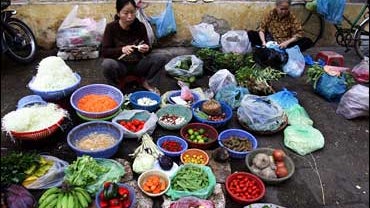 women sell goods on street 