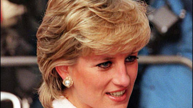 Lady Diana arriving in a London hospital surrounded by photographers for a charity visit. 