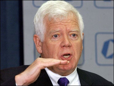 US Congressman Jim McDermott gestures while addressing a speech at the Confederation of Indian Industry 