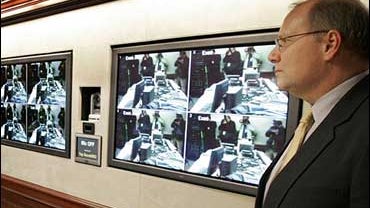 White House Deputy Chief of Staff Joseph Hagin looks at the newly overhauled Situation Room at the White House in Washington, Tuesday, Dec. 19, 2006. 