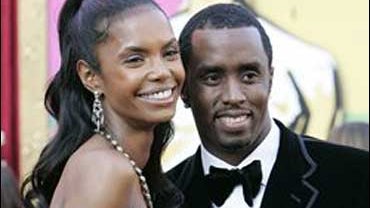Sean " Diddy" Combs arrives with his girlfriend Kim Porter for the Academy Awards on Feb. 27, 2005, in Los Angeles. They became the parents of twin girls Thursday morning, Dec. 21, 2006, with the hip-hop impresario flying in from a movie set in Canada for 